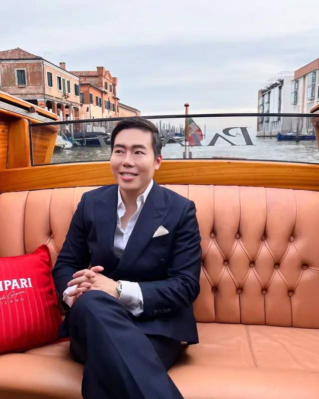 Luke Lee in a water taxi in Venice